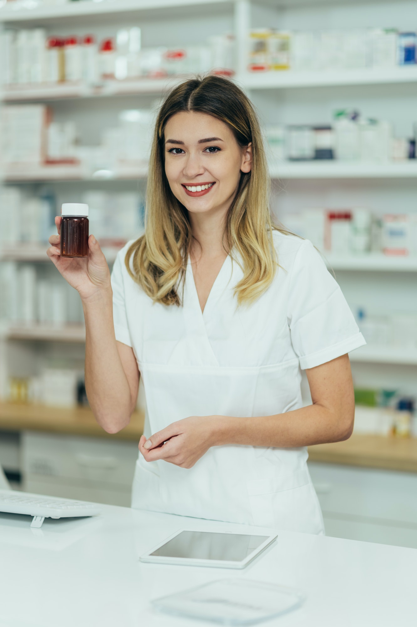 Portrait of a beautiful female pharmacist working in a pharmacy 1.jpg